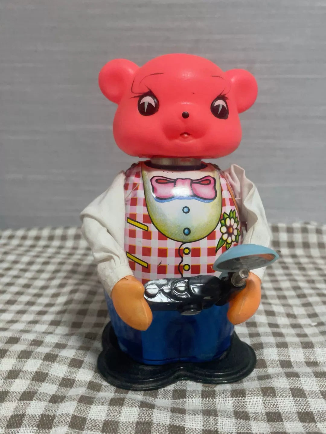 161026-toy-1 An old tin toy bear from the 1980s takes pictures with clockwork camer