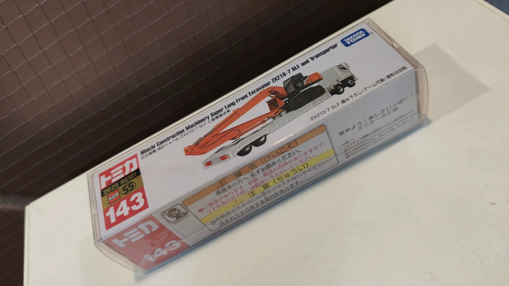 150926-toy-24 Tomica Long Box Long Car New Car Sticker No. 143 Hitachi Construction Machinery Heavy Lift Truck Hitachi Construction Machinery Super Long Front Excavator ZX210-7 SLF and Transporter