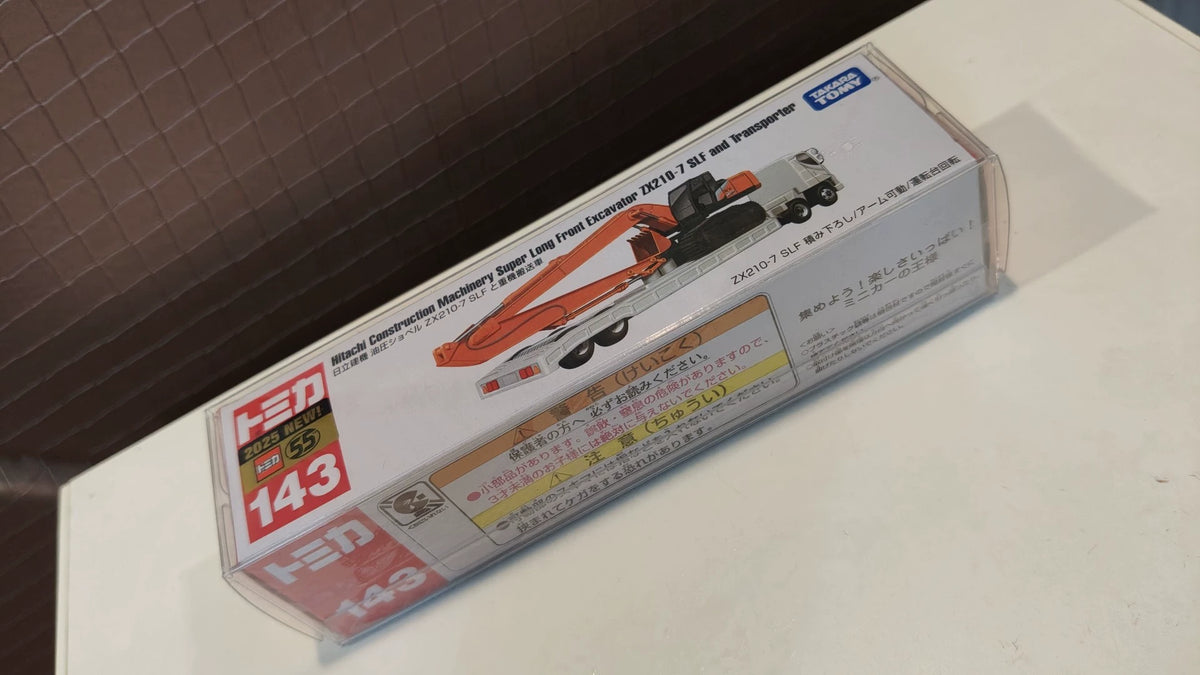 150926-toy-24 Tomica Long Box Long Car New Car Sticker No. 143 Hitachi Construction Machinery Heavy Lift Truck Hitachi Construction Machinery Super Long Front Excavator ZX210-7 SLF and Transporter